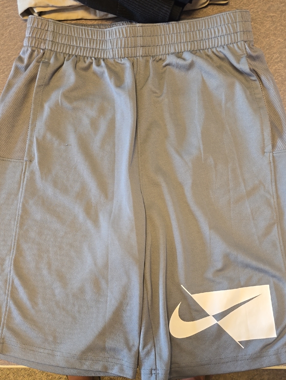 Nike Gray Athletic Shorts with White Swoosh